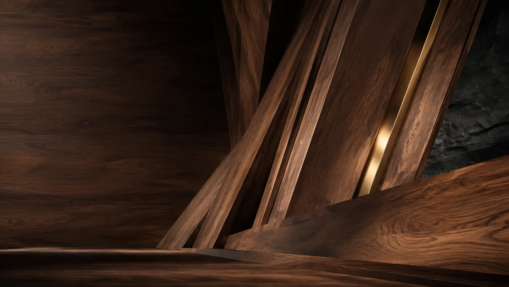 Architectural walnut forms joined by a narrow brass seam